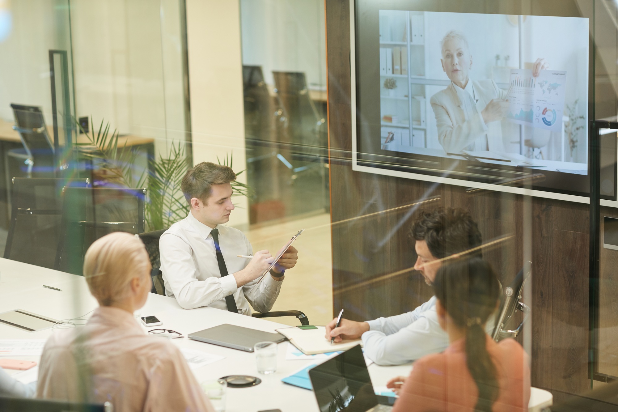 People sitting at online conference at office